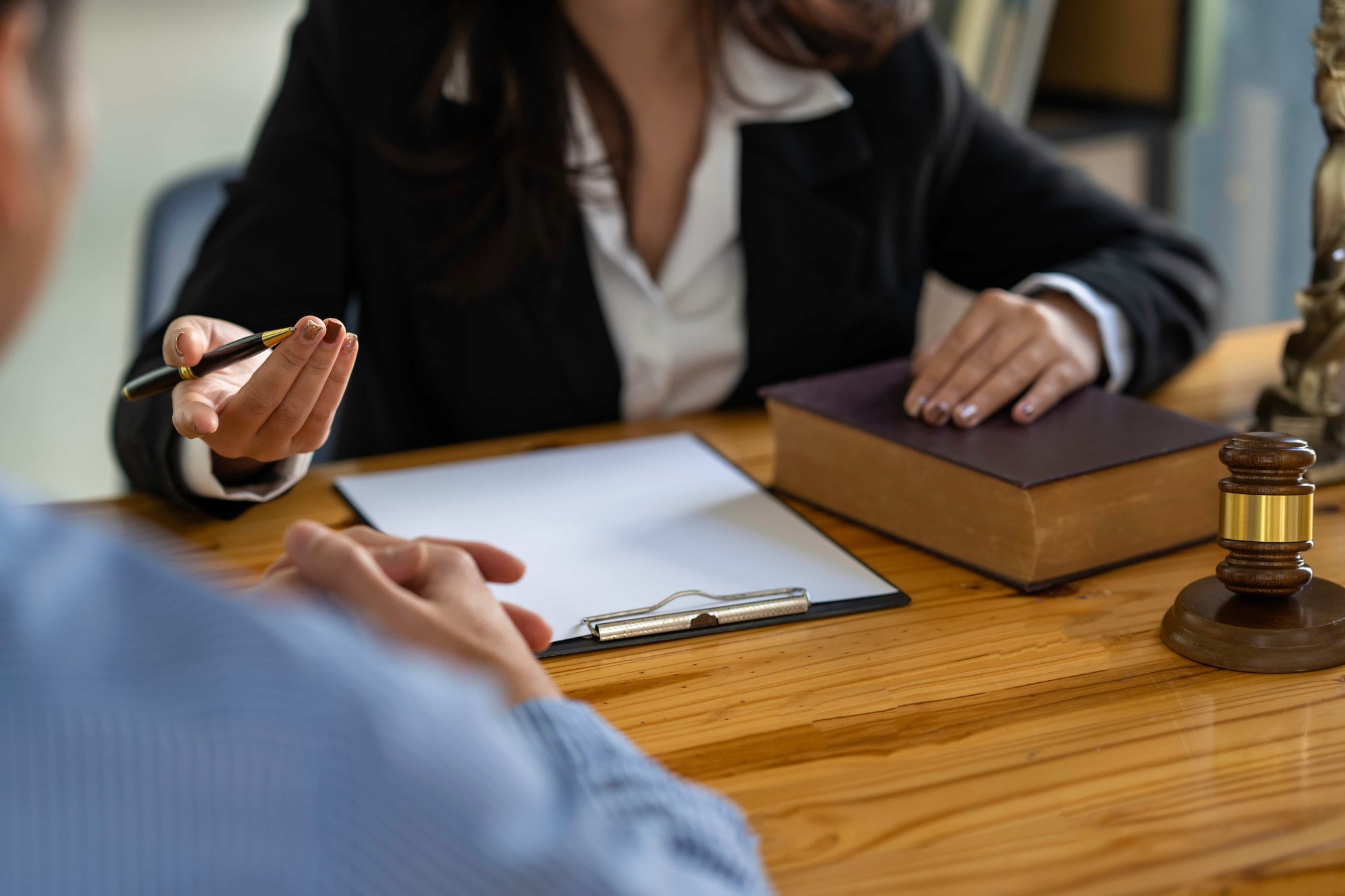 Female lawyer leading a legal team meeting