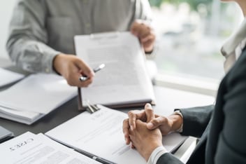 Lawyer explains retainer agreement to client