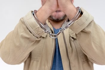 man showing handcuffed hands