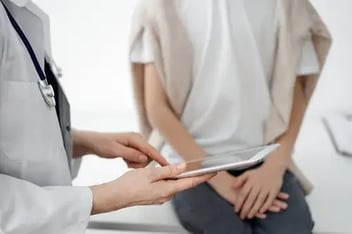 doctor with tablet in medical sex examination with minor