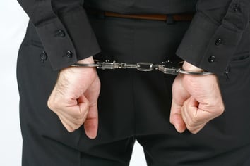 Arrested. Hand Cuffed.