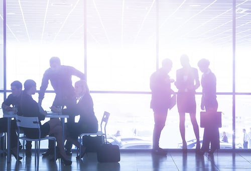 A group of executives having a discussion on a lobby.