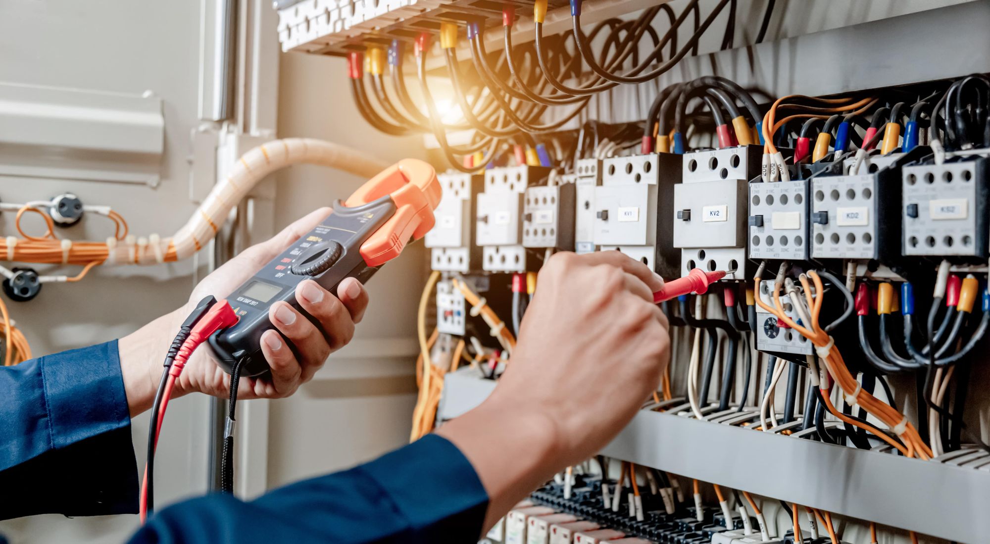 An Image of an electrician working