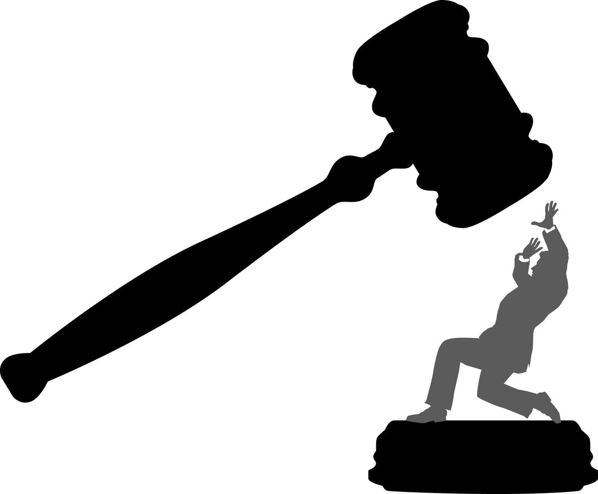 A gavel coming down on a man with raised hands